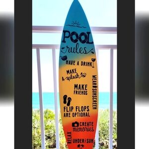Pool rules on surfboard shaped wood of Blue, Yellow, Orange etc